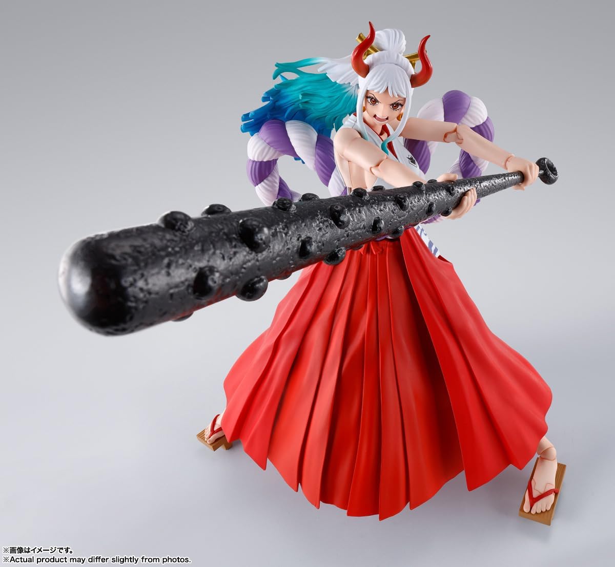 Anime character figurine with large weapon on a gray background One Piece: Yamato (The Raid on Onigashima Ver.) Authentic S.H. Figuarts Fully Articulated Action Figure by Bandai Spirits