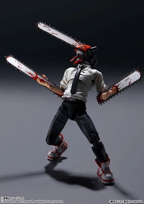 Action figure with a chainsaw on a gray background S.H.Figuarts Chainsaw Man Authentic Action Figure – 5.9-Inch Fully Articulated Premium Collectible Character Statue by Bandai Tamashii Nations