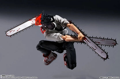 Action figure with a chainsaw attached to its back on a gray background S.H.Figuarts Chainsaw Man Authentic Action Figure – 5.9-Inch Fully Articulated Premium Collectible Character Statue by Bandai Tamashii Nations