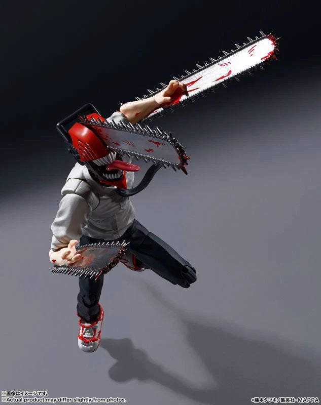 Action figure with a chainsaw weapon on a dark background S.H.Figuarts Chainsaw Man Authentic Action Figure – 5.9-Inch Fully Articulated Premium Collectible Character Statue by Bandai Tamashii Nations frontal