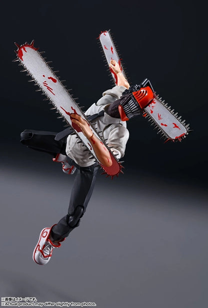 Action figure with chainsaws attached to arms against a dark background S.H.Figuarts Chainsaw Man Best Selection Authentic Action Figure – 15cm Fully Articulated Tamashii Nations Store Limited Exclusive Edition