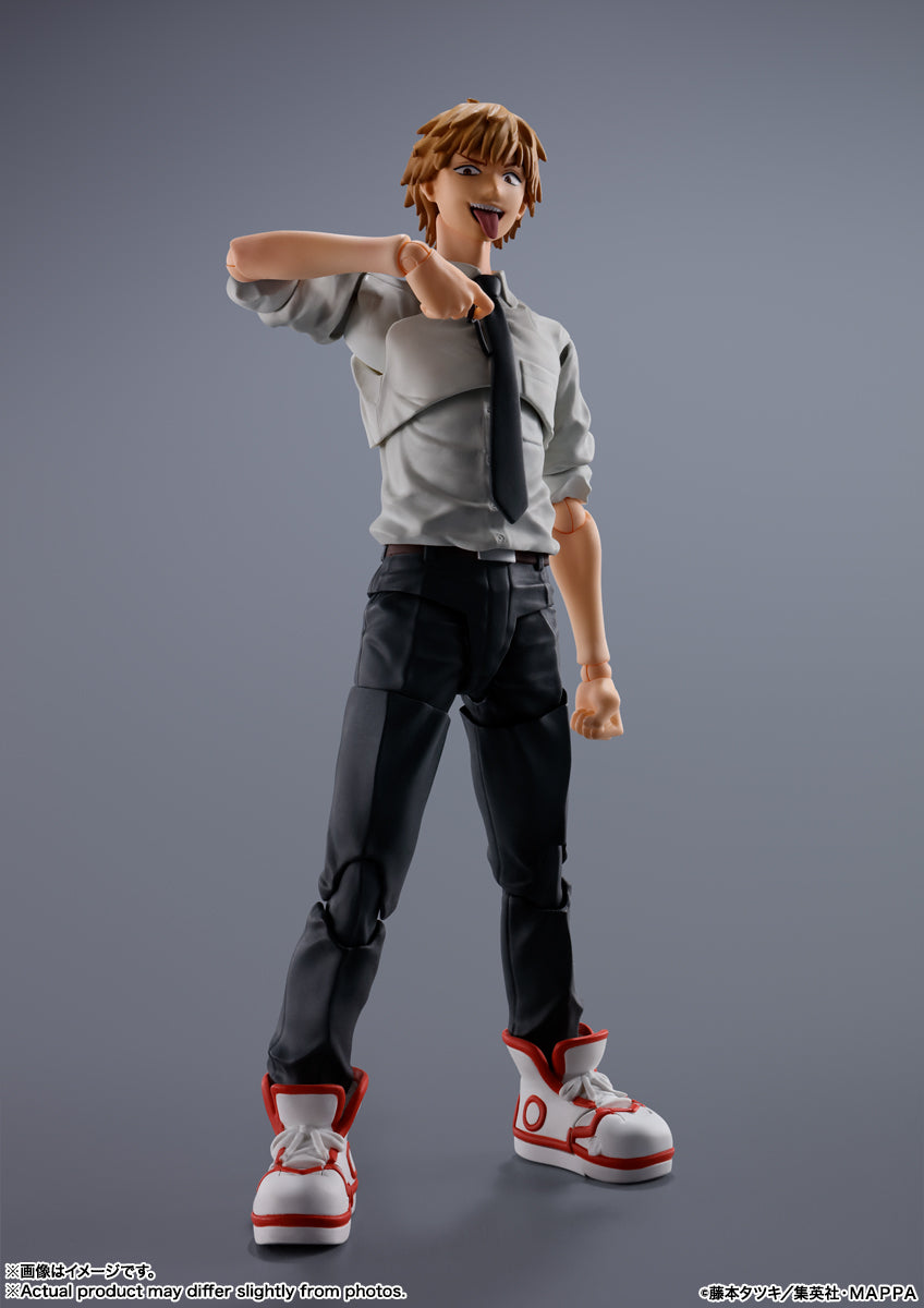 Action figure of a character in a gray shirt and black pants on a gray background S.H.Figuarts Denji Authentic Action Figure – 5.9-Inch Human Form Fully Articulated Premium Collectible with Pochita Figure by Bandai Tamashii Nations