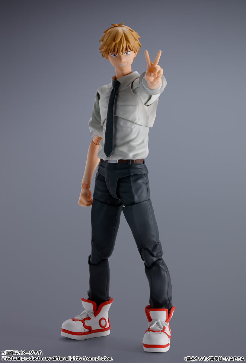 Action figure of a character with blonde hair and a gray outfit on a gray background S.H.Figuarts Denji Authentic Action Figure – 5.9-Inch Human Form Fully Articulated Premium Collectible with Pochita Figure by Bandai Tamashii Nations