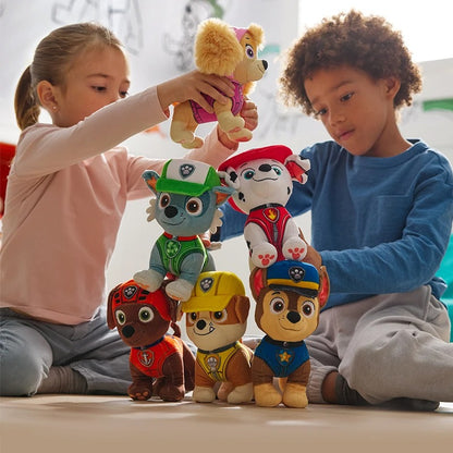 Two children playing with Paw Patrol plush toys on a light-colored floor. Skye Classic Everyday Edition – 7-Inch Premium Cotton Plush by Titantoons