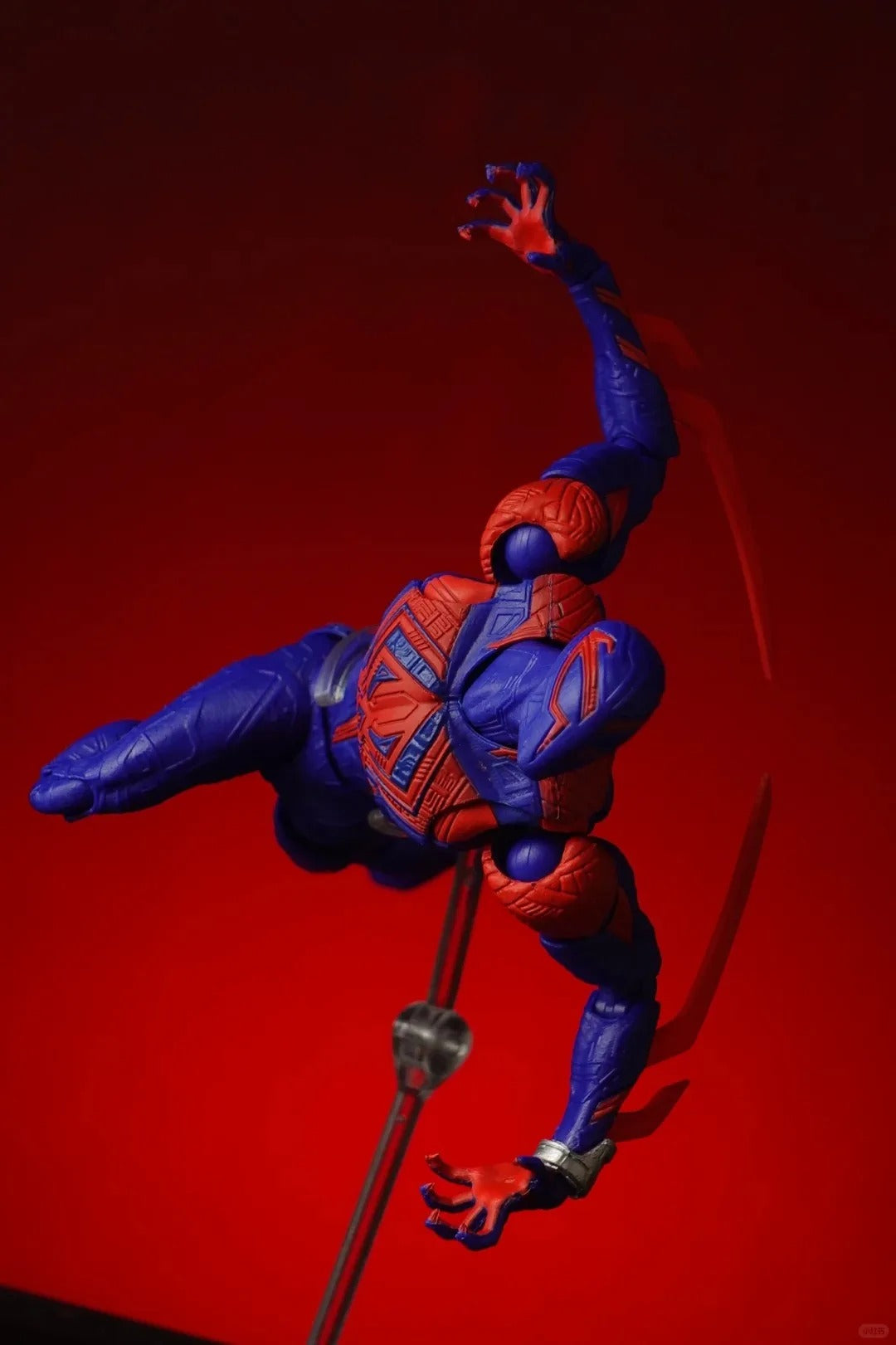 Superhero action figure in blue and red costume on a red background Spider-Man 2099 (Miguel O'Hara) Across The Spider-Verse 1/12 Scale Action Figure by CT Toys