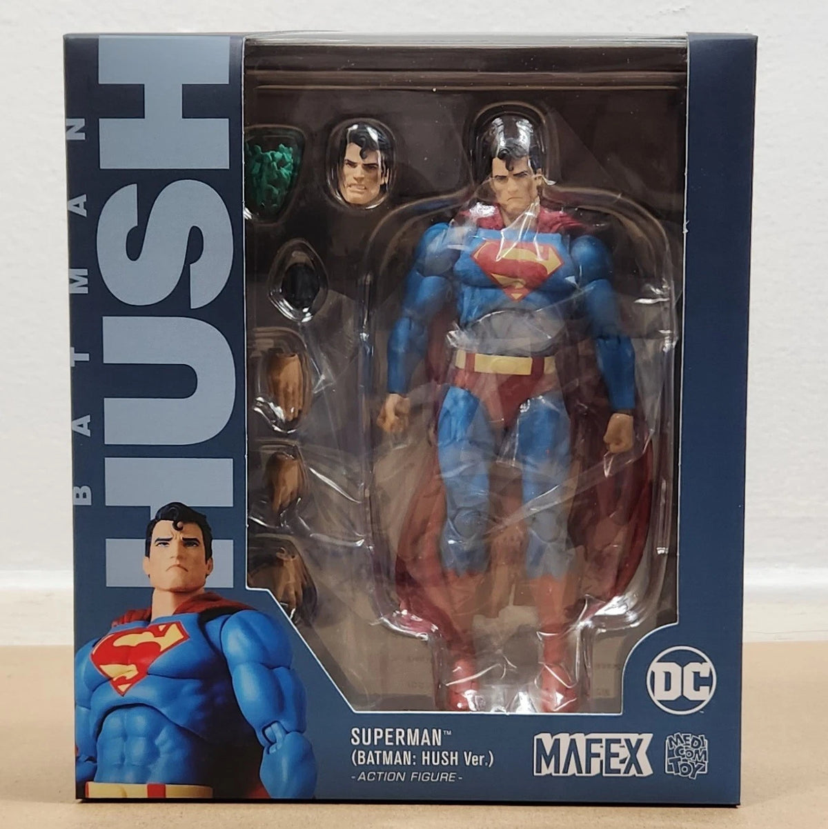 Superman action figure in packaging with 'Batman: Hush' text and Mafex branding. Superman: Hush Edition (No. 117) 1/12 Scale Collectible Action Figure by CT Toys