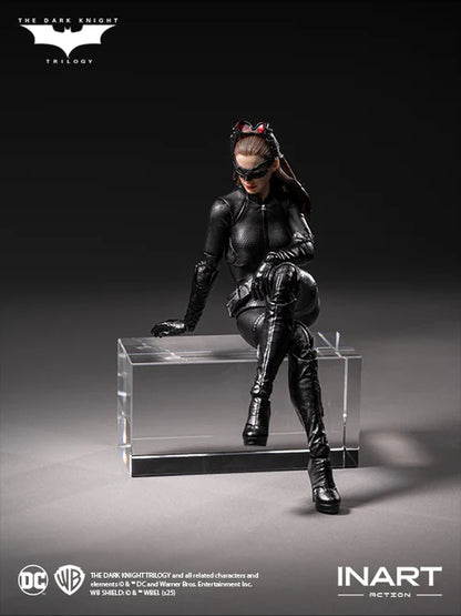 Catwoman figure from The Dark Knight Trilogy on a clear platform with INART branding.