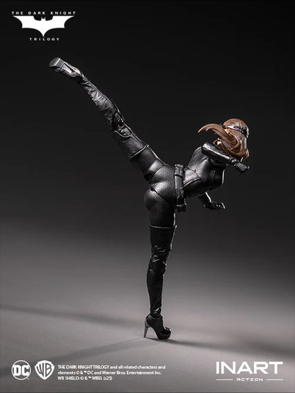 Action figure of a character in a black leather outfit with high heels, posing dynamically on a gray background.