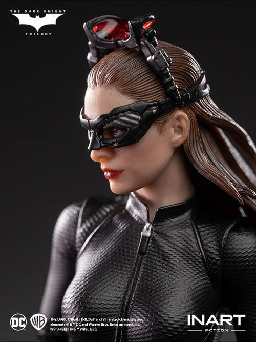 Catwoman figure from 'The Dark Knight Trilogy' with INART branding on a dark background