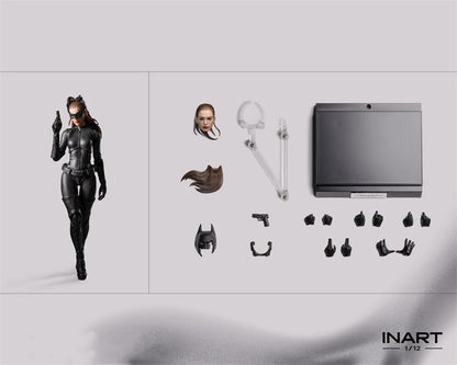 Action figure with accessories on a gray background, featuring the brand 'INART'. The Dark Knight Rises Catwoman 1/12 Scale Collectible Action Figure by INART 