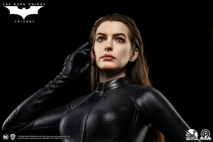 Character in black suit with 'The Dark Knight Trilogy' logo on a dark background The Dark Knight Rises Catwoman (Selina Kyle) 1:1 Scale Life-Size Masterpiece Bust by Infinity Studio x Penguin Toys