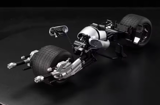 Model of a Batmobile on a dark background The Dark Knight Trilogy Bat-Pod 1/12 Scale Precision Assembly Model Kit by Modoking
