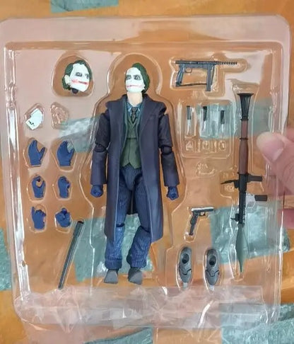 Action figure of a character in a blue coat with accessories in packaging The Joker: The Dark Knight Edition (No. 051) 1/12 Scale Collectible Action Figure